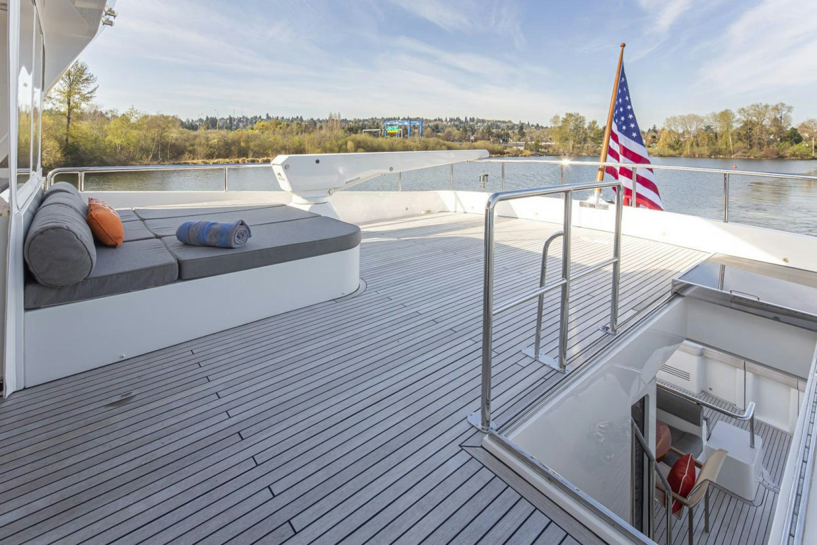a boat with a flag on the deck aboard PARAGON COCKPIT Yacht for Sale