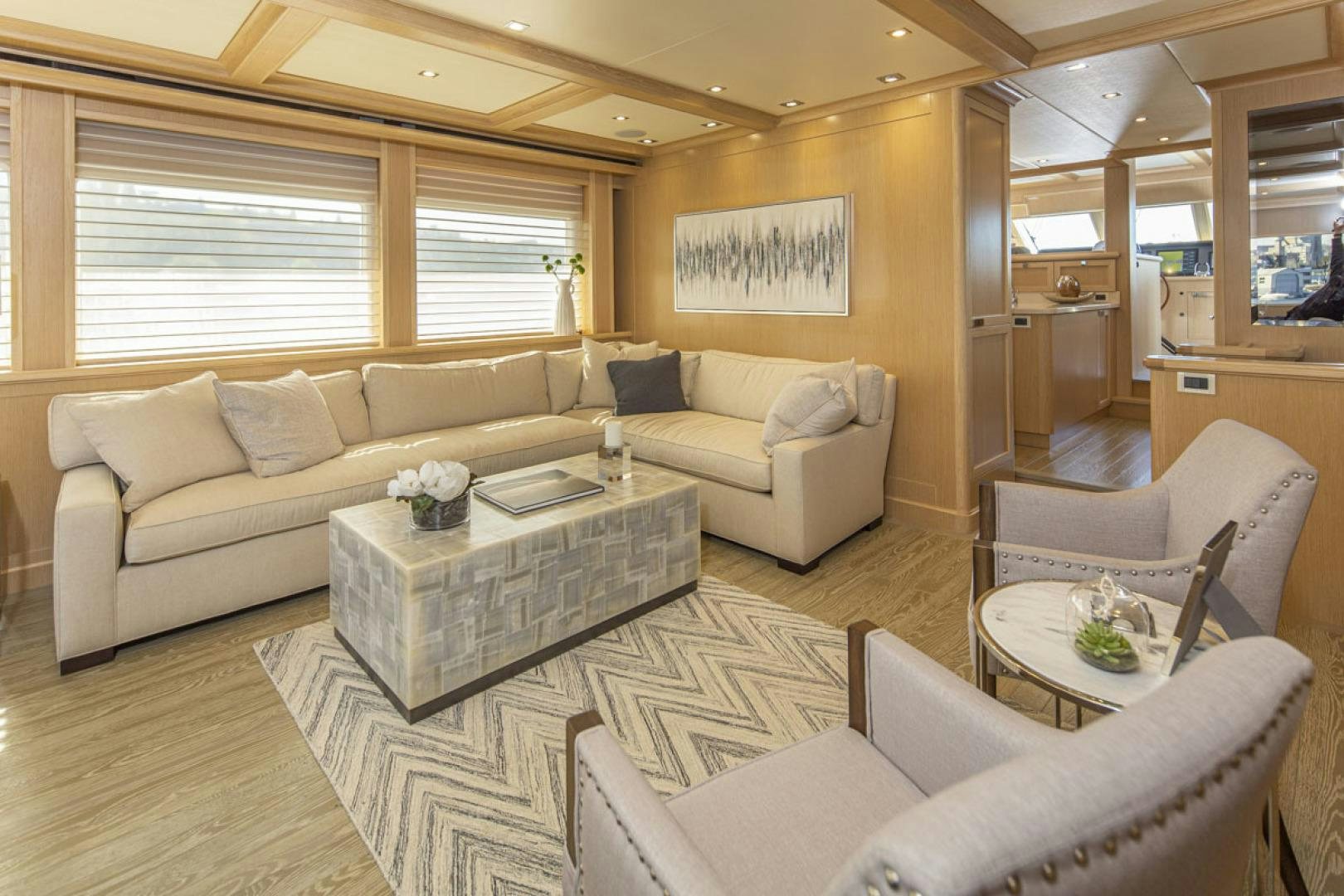 a living room with a couch and a coffee table aboard PARAGON COCKPIT Yacht for Sale