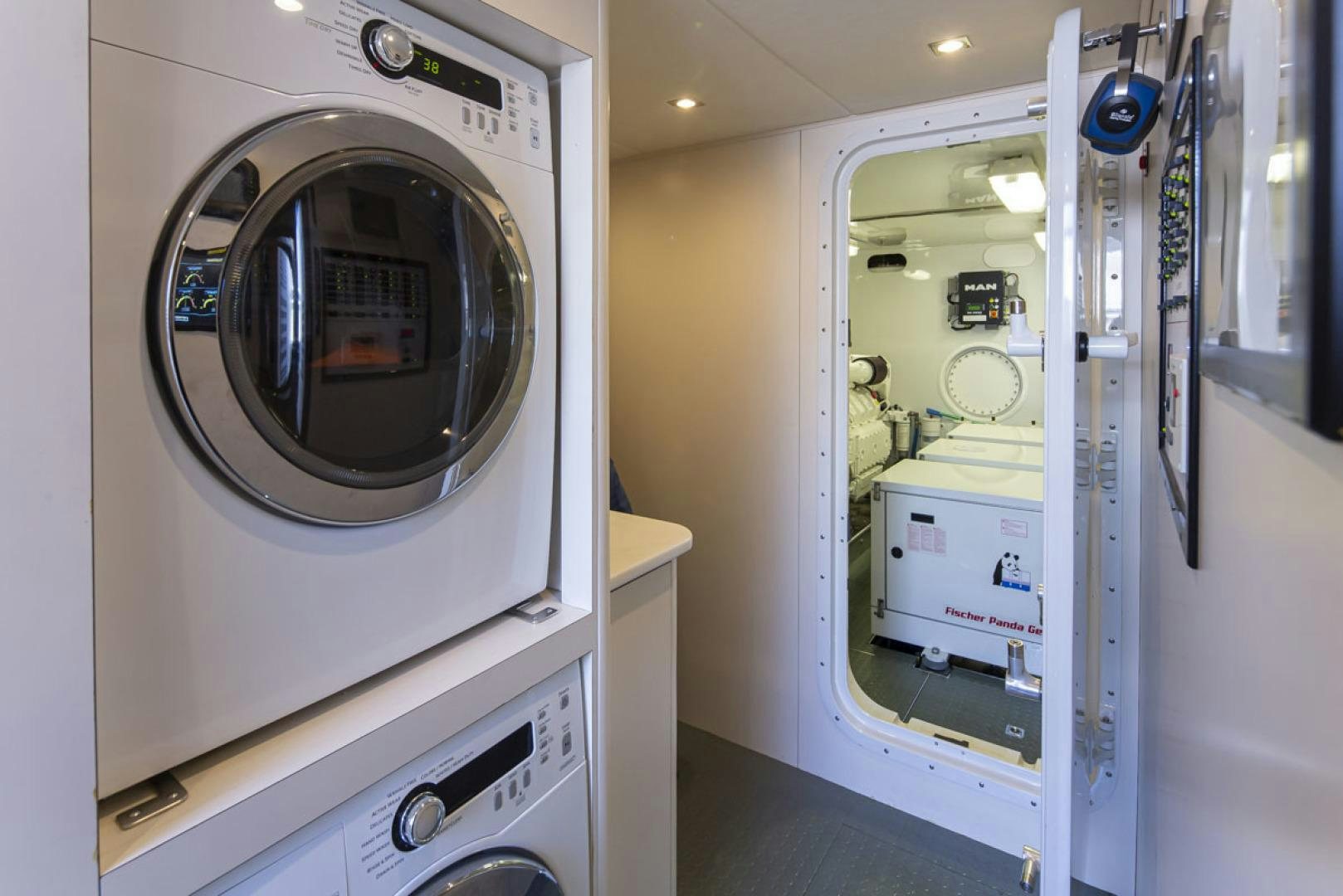 a room with washer and dryer aboard PARAGON COCKPIT Yacht for Sale