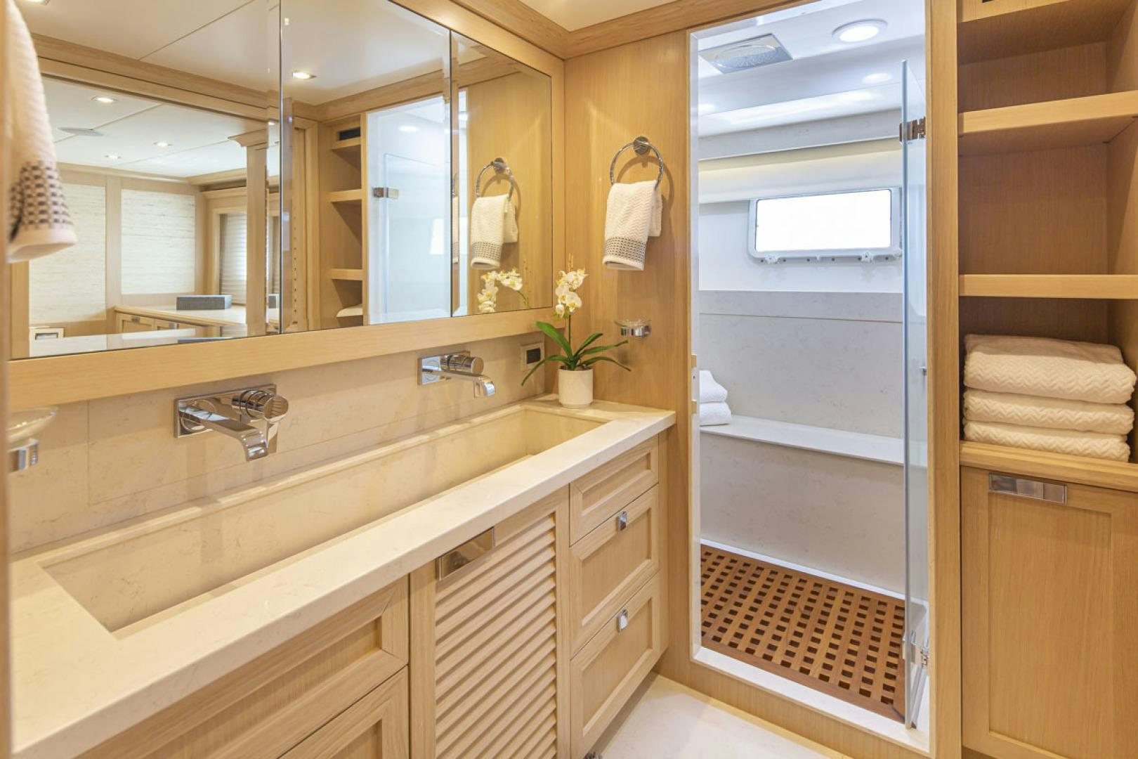 a bathroom with a sink and a mirror aboard PARAGON COCKPIT Yacht for Sale