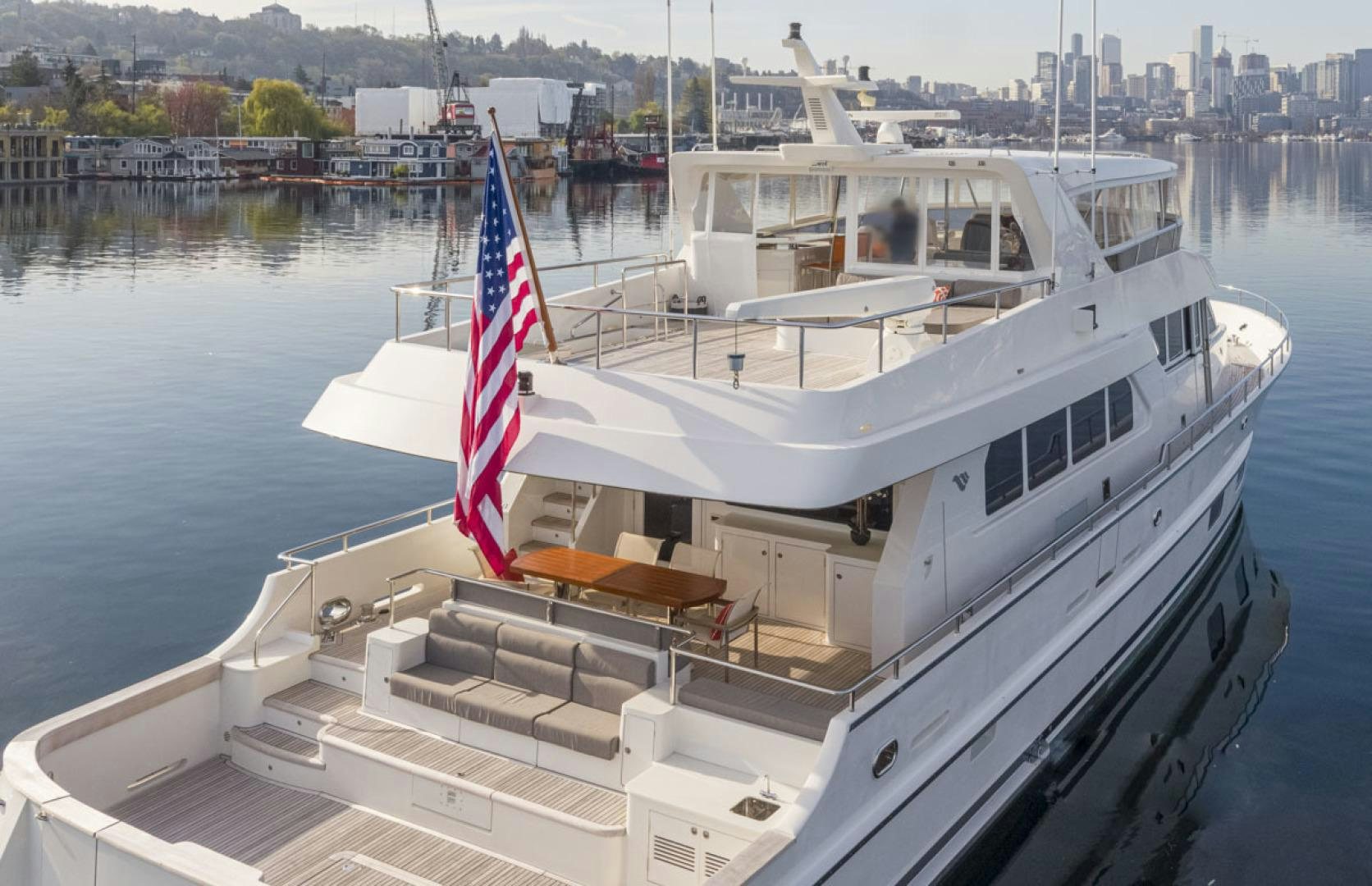 a boat with a flag on it aboard PARAGON COCKPIT Yacht for Sale