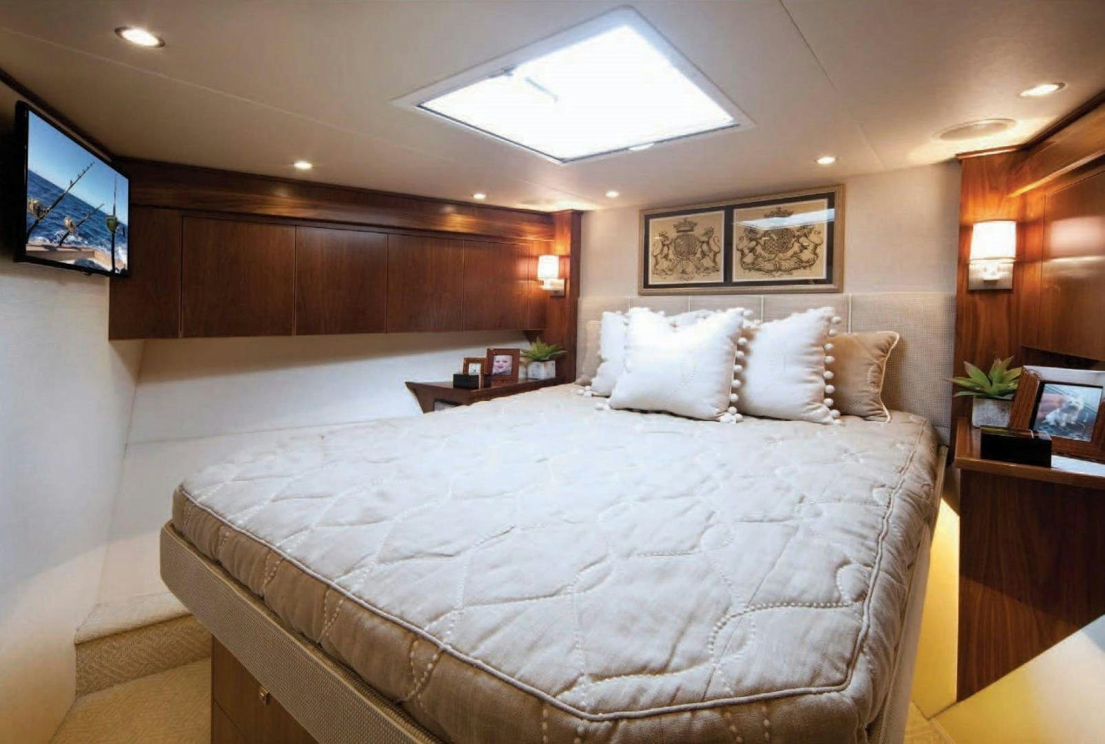 a bed with a white comforter aboard 2022 Yacht for Sale