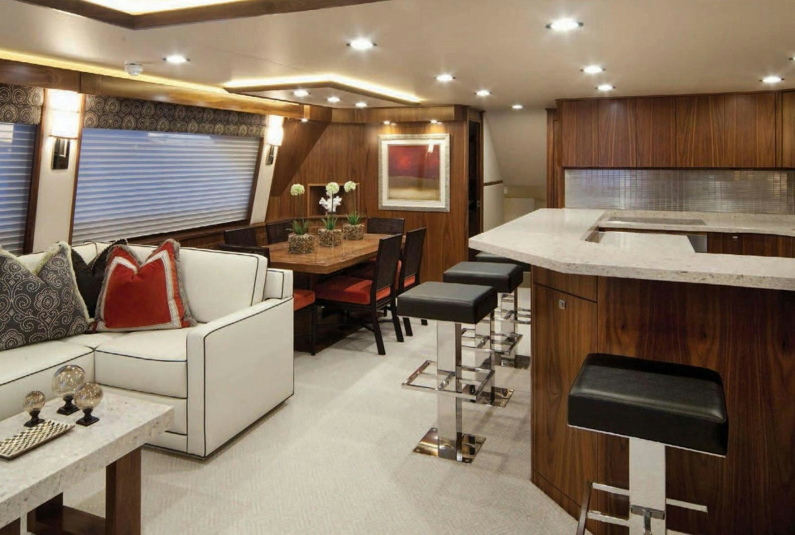 a living room with a couch and a table aboard 2022 Yacht for Sale
