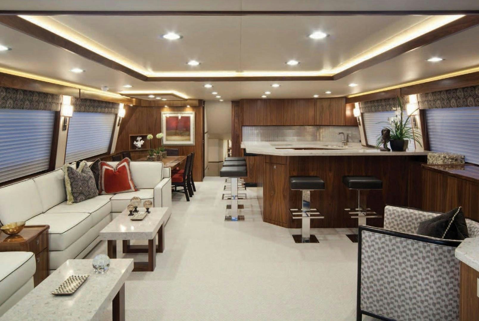 a living room with a couch and a table aboard 2022 Yacht for Sale