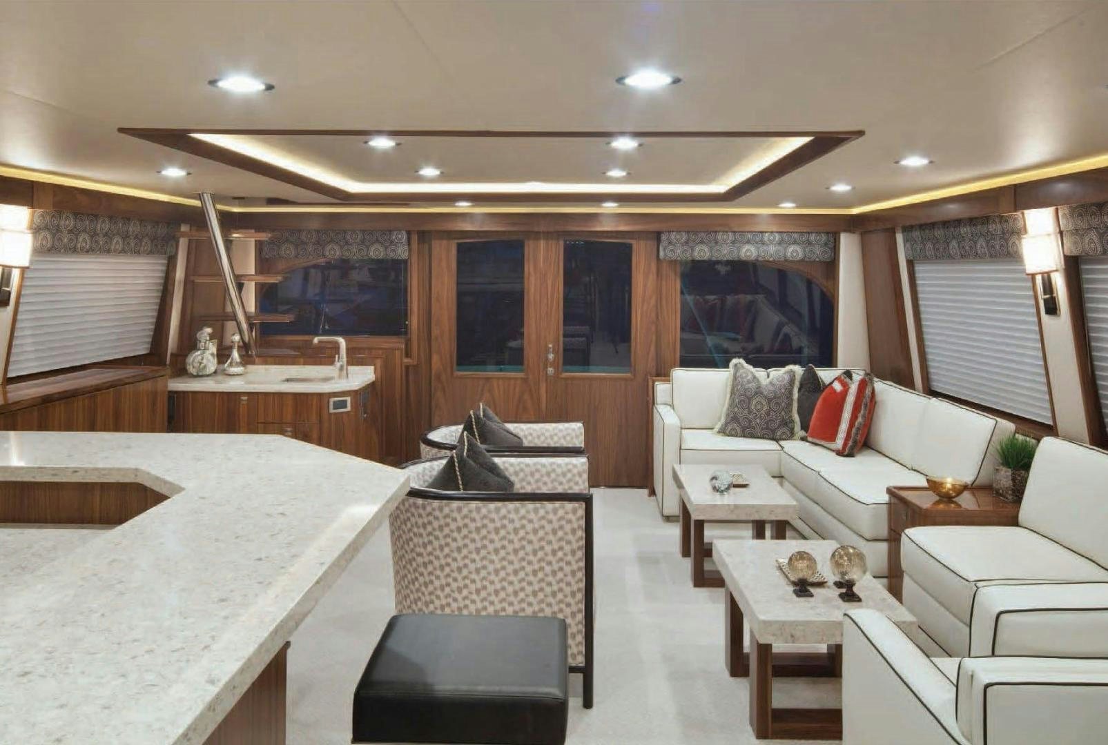 a room with a couch and a table aboard 2022 Yacht for Sale