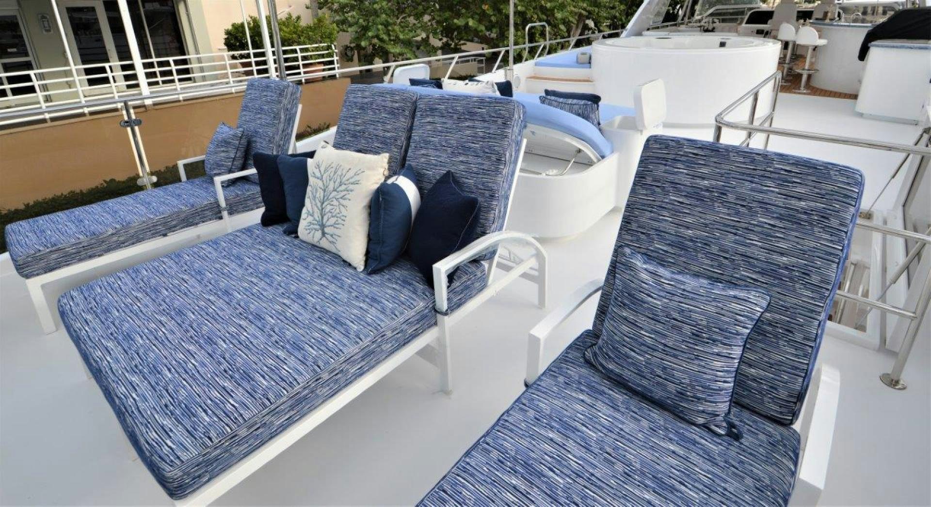 a group of chairs and tables outside aboard NO NAME Yacht for Sale