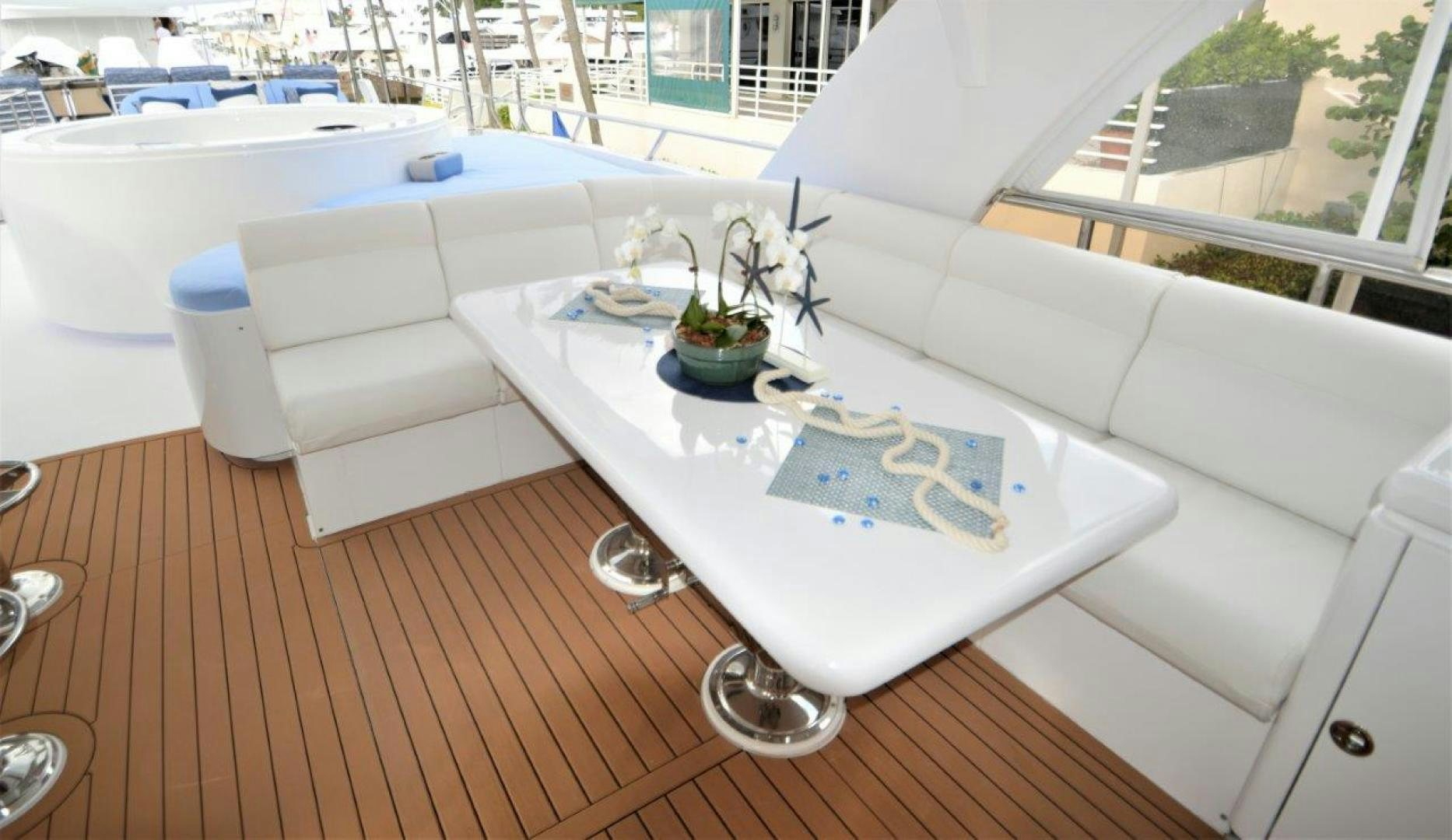 a white couch with a vase of flowers on it aboard NO NAME Yacht for Sale