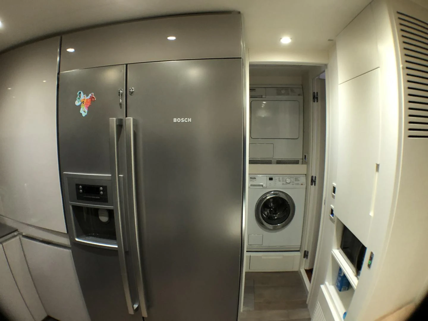 a large refrigerator in a room aboard DORIS Yacht for Sale