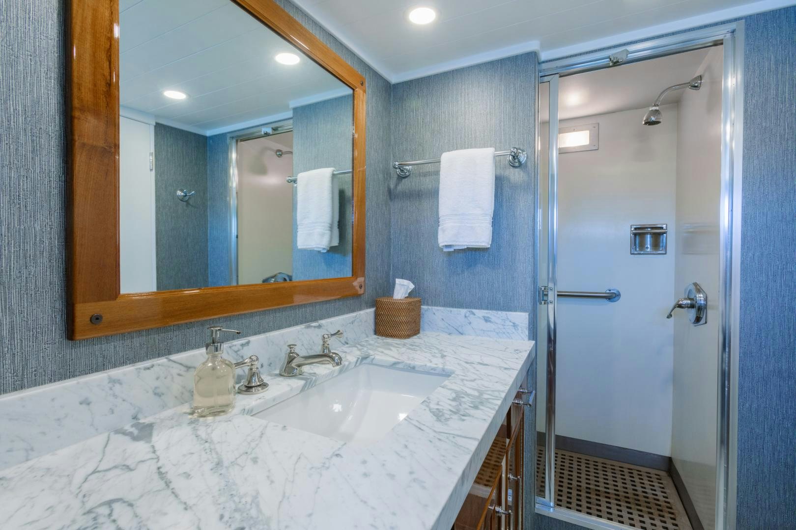 a bathroom with a large mirror aboard NORDIC STAR Yacht for Sale