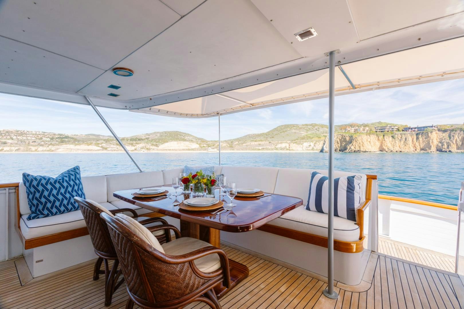 a table and chairs on a deck aboard NORDIC STAR Yacht for Sale