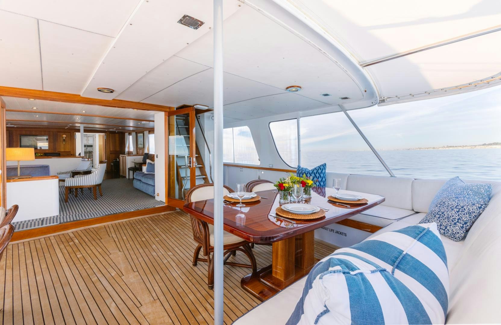 a boat with a table and chairs aboard NORDIC STAR Yacht for Sale
