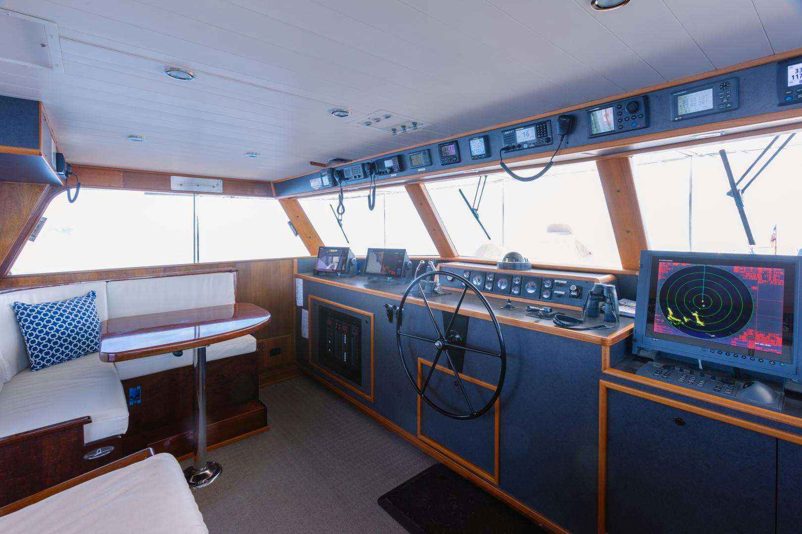 a room with a bed and a desk aboard NORDIC STAR Yacht for Sale
