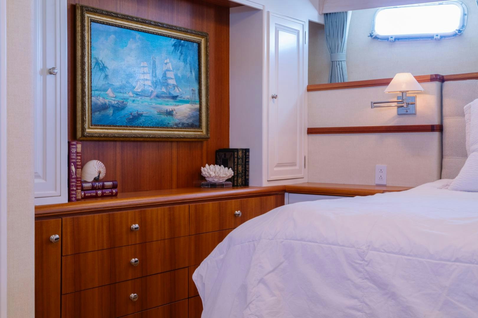 a bedroom with a painting on the wall aboard NORDIC STAR Yacht for Sale