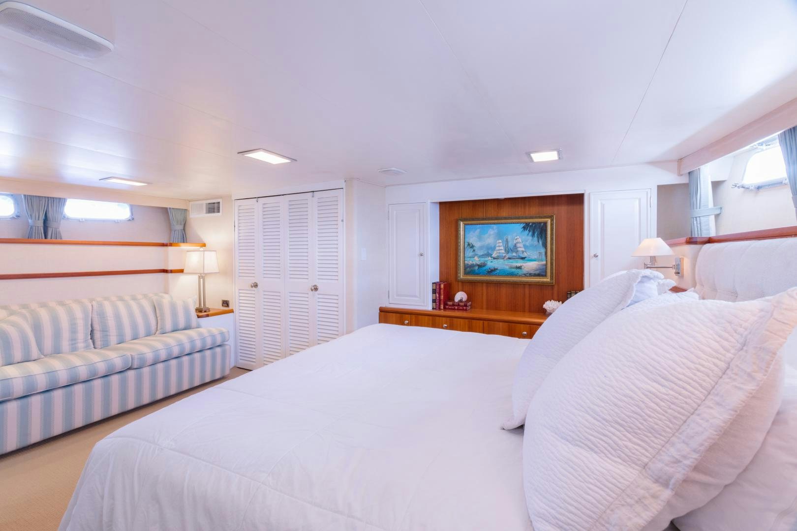 a bedroom with a bed and a television aboard NORDIC STAR Yacht for Sale