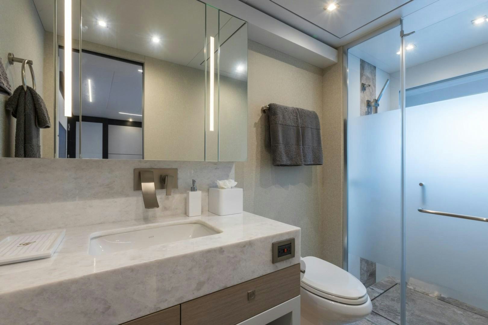a bathroom with a sink and a mirror aboard No Name Yacht for Sale