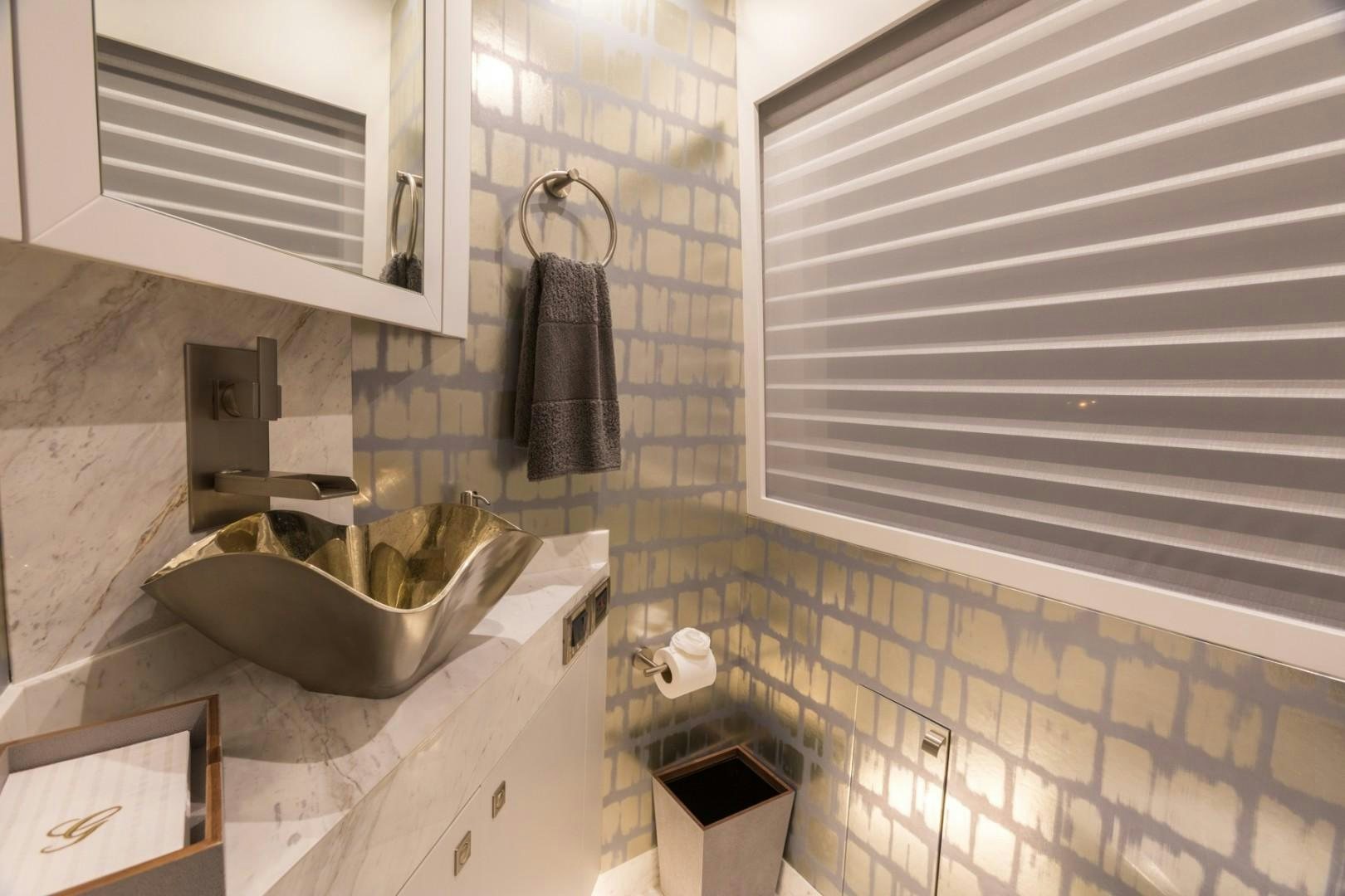 a bathroom with a sink and a mirror aboard No Name Yacht for Sale