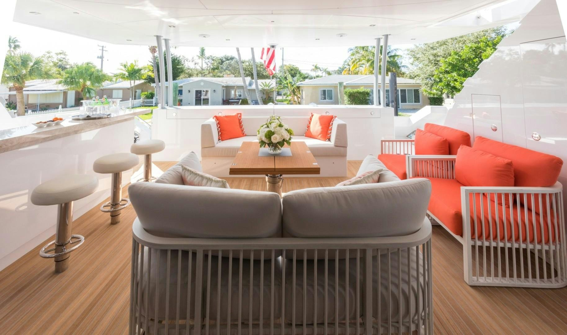 a room with couches and tables aboard No Name Yacht for Sale