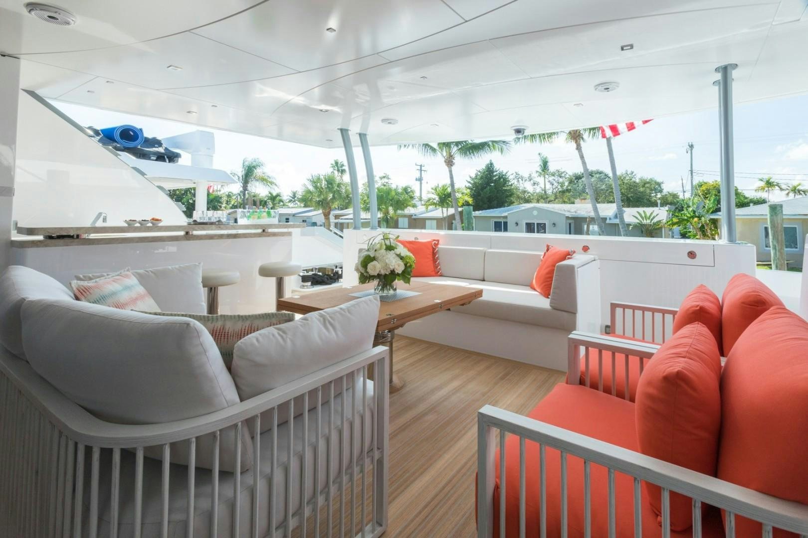 a room with couches and chairs aboard No Name Yacht for Sale