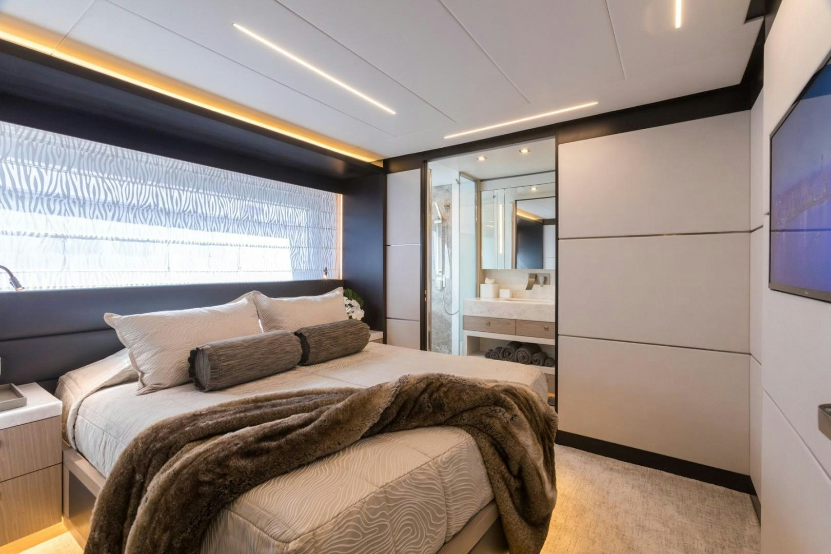 a bedroom with a large bed aboard No Name Yacht for Sale