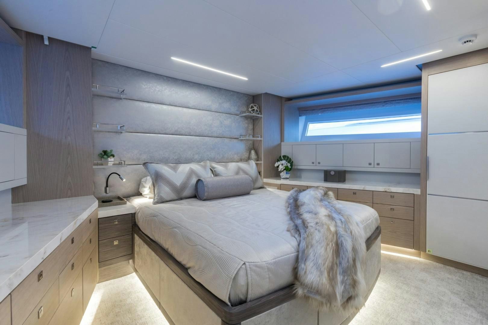 a bedroom with a large bed aboard No Name Yacht for Sale