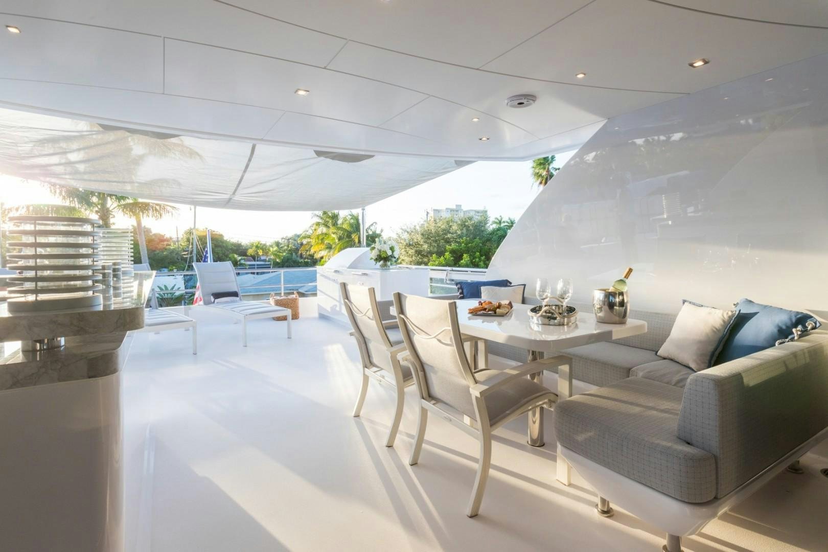 a room with a couch and a table aboard No Name Yacht for Sale