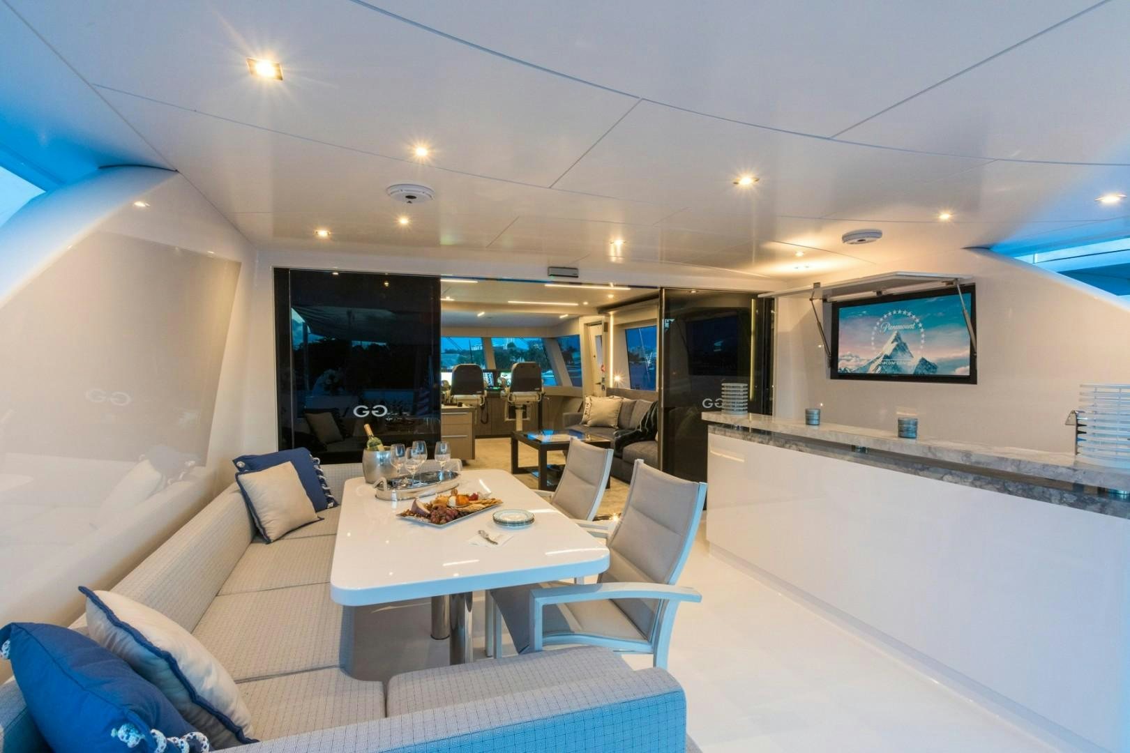 a room with a table and chairs aboard No Name Yacht for Sale