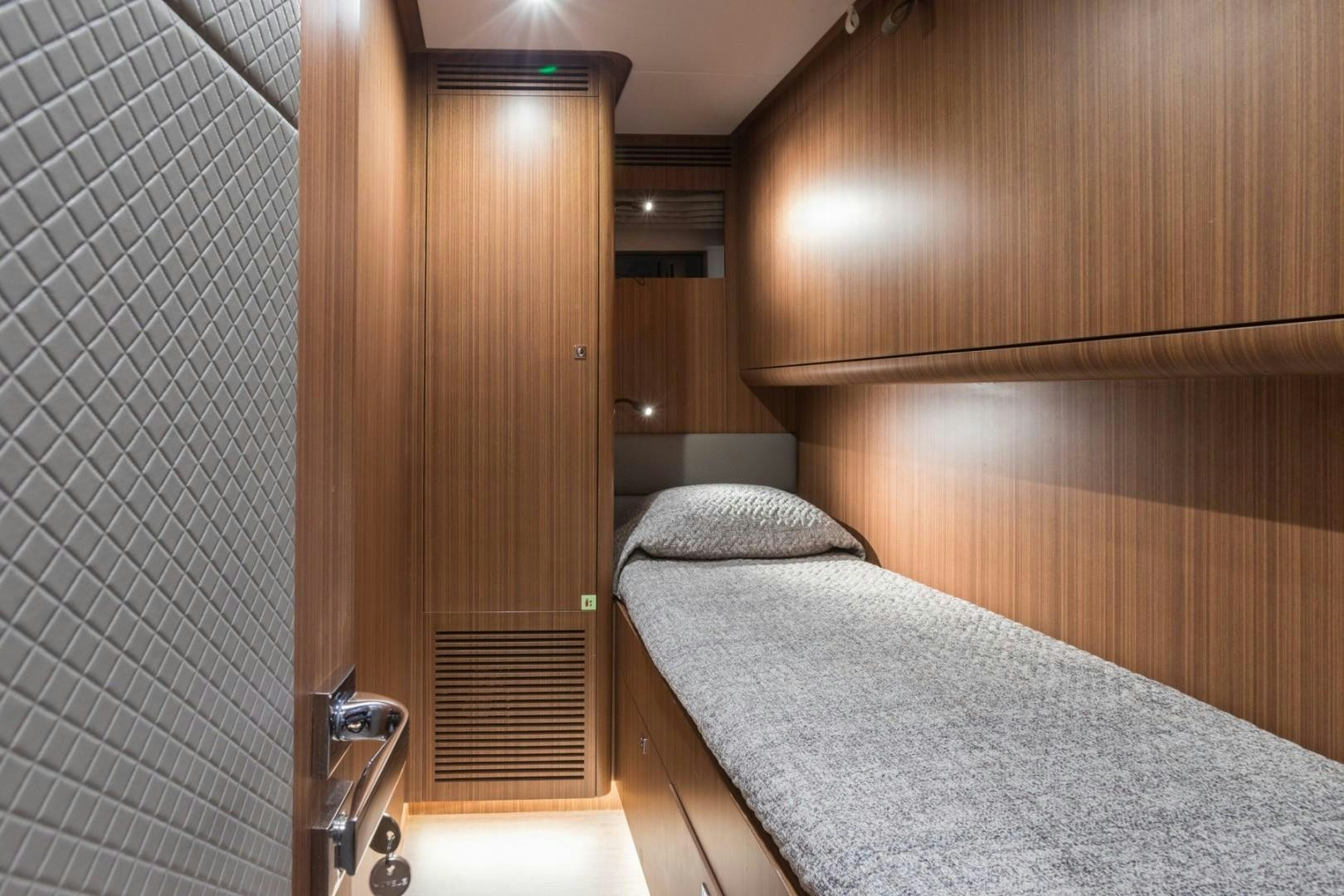 a bed in a room aboard No Name Yacht for Sale