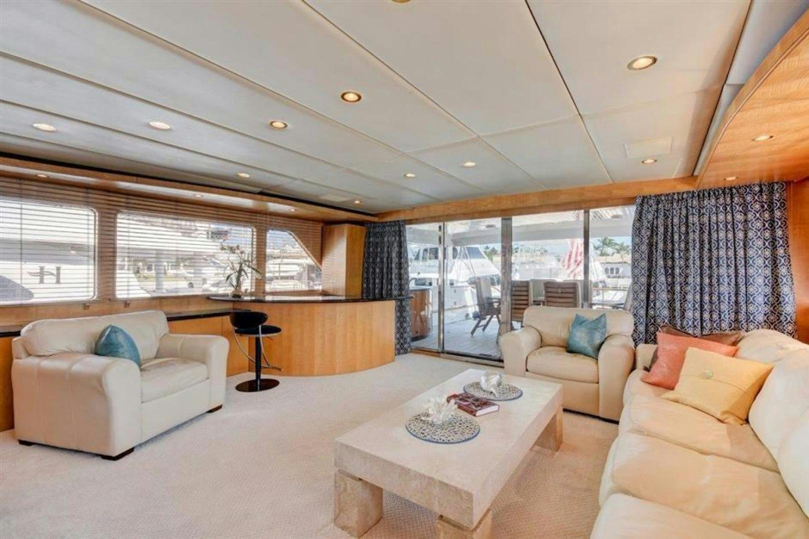 a living room with a large window aboard LUCKY STAR Yacht for Sale