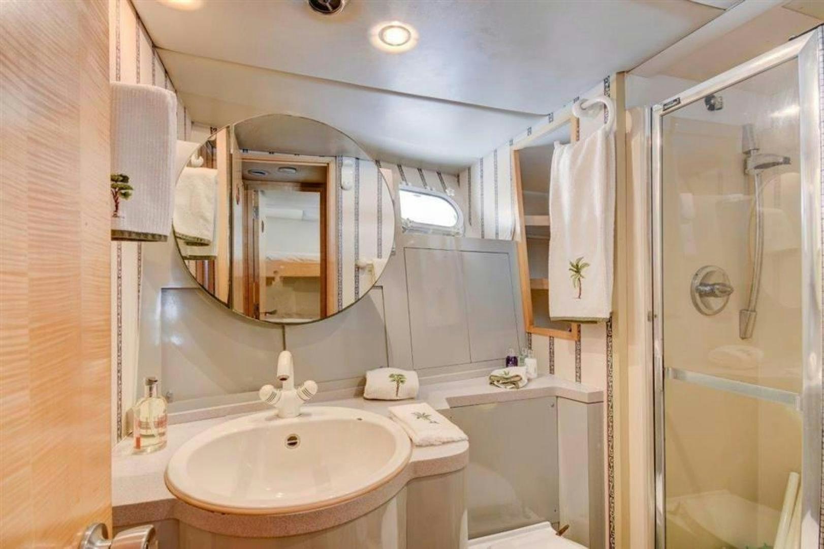 a bathroom with a sink and a mirror aboard LUCKY STAR Yacht for Sale