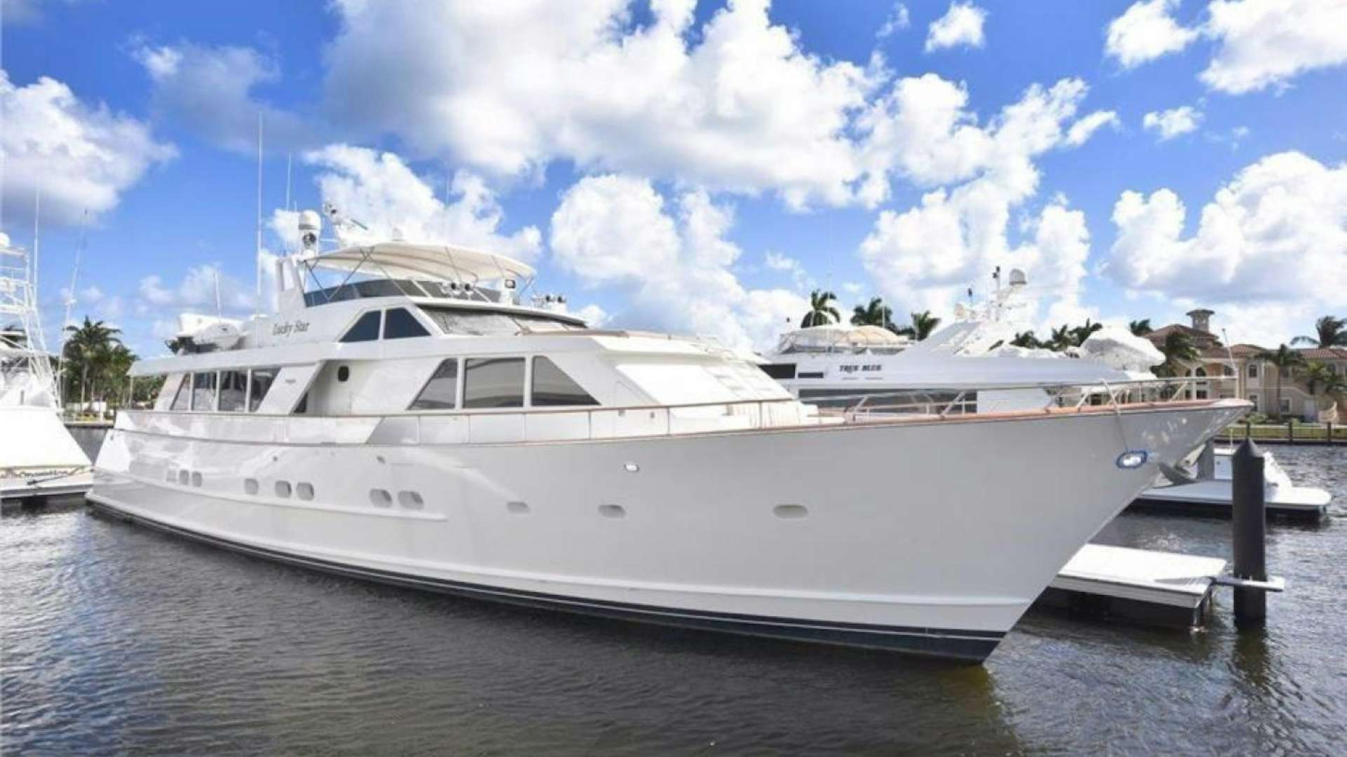 a large white yacht aboard LUCKY STAR Yacht for Sale