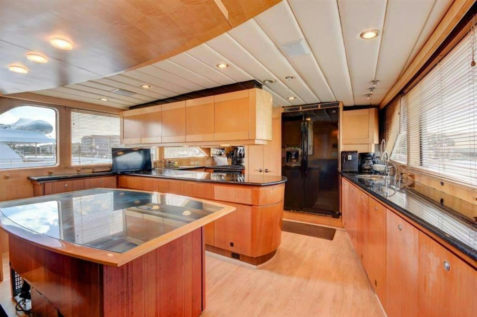 a kitchen with wooden cabinets aboard LUCKY STAR Yacht for Sale