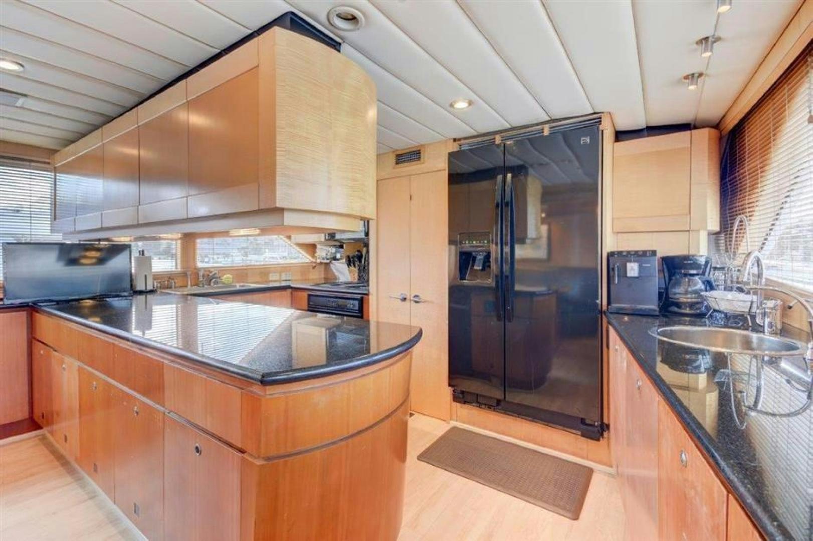 a kitchen with stainless steel appliances aboard LUCKY STAR Yacht for Sale