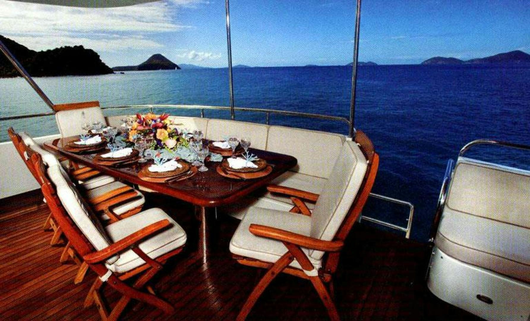 a table set for a meal on a boat aboard SELF MADE Yacht for Sale