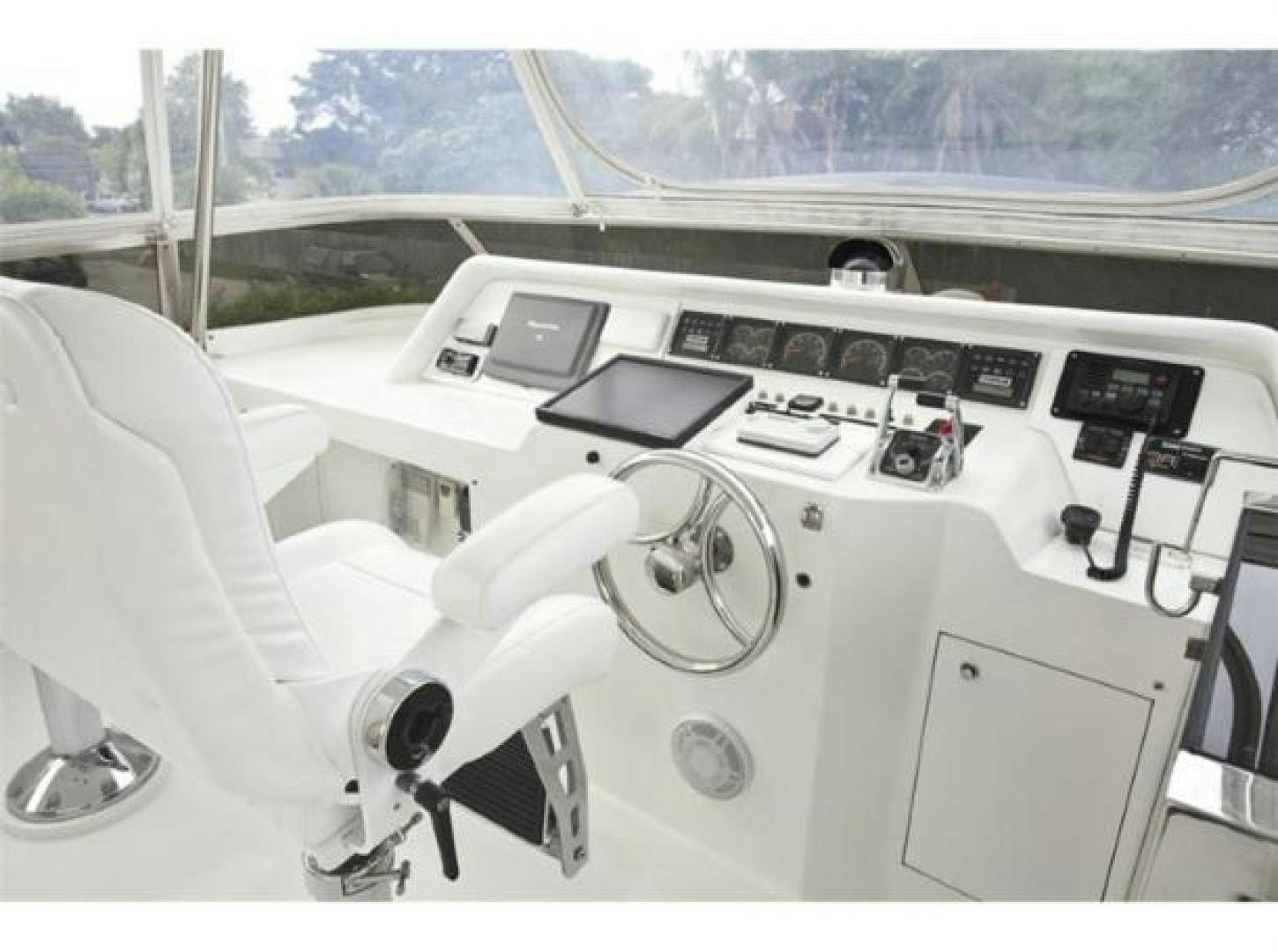 a white car with a hood open aboard SELF MADE Yacht for Sale