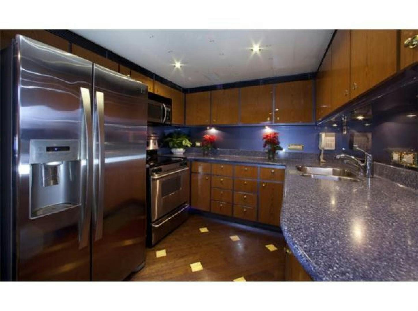 a large kitchen with stainless steel appliances aboard SELF MADE Yacht for Sale