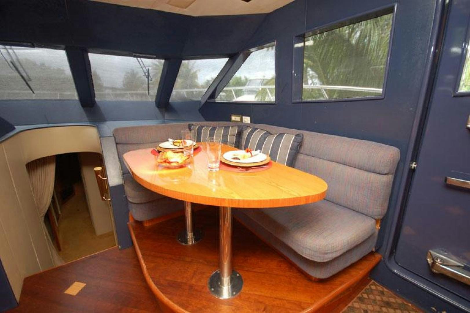 a table with plates and food on it aboard SELF MADE Yacht for Sale