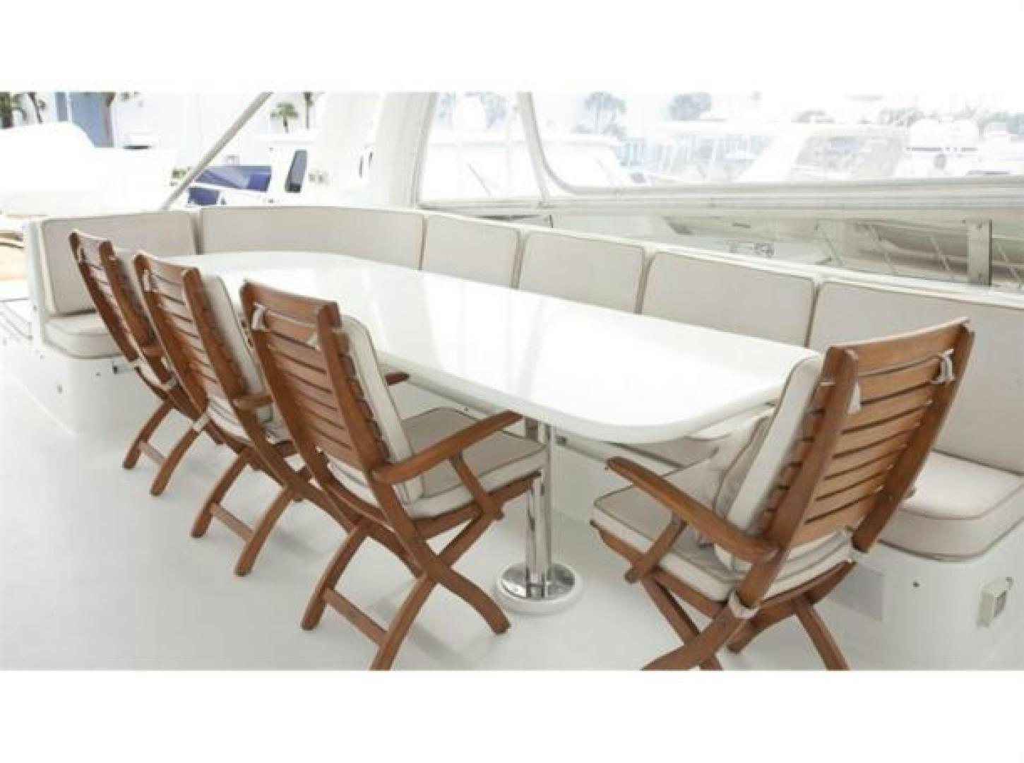 a group of chairs around a table aboard SELF MADE Yacht for Sale