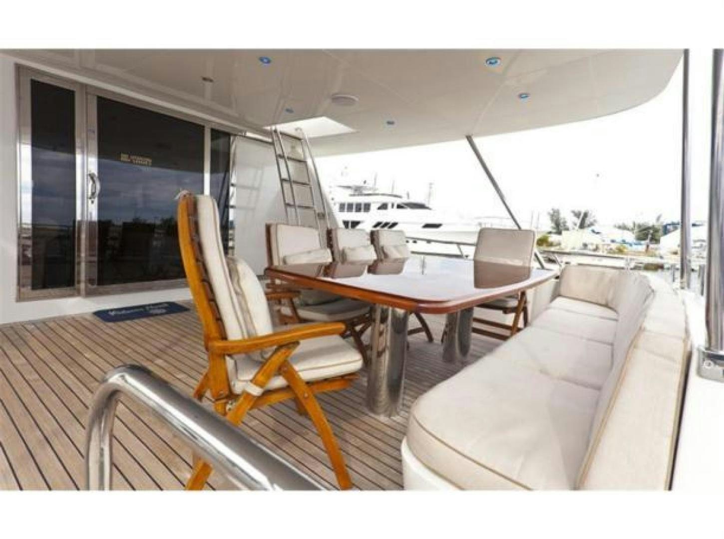 a living room with a couch and a table aboard SELF MADE Yacht for Sale