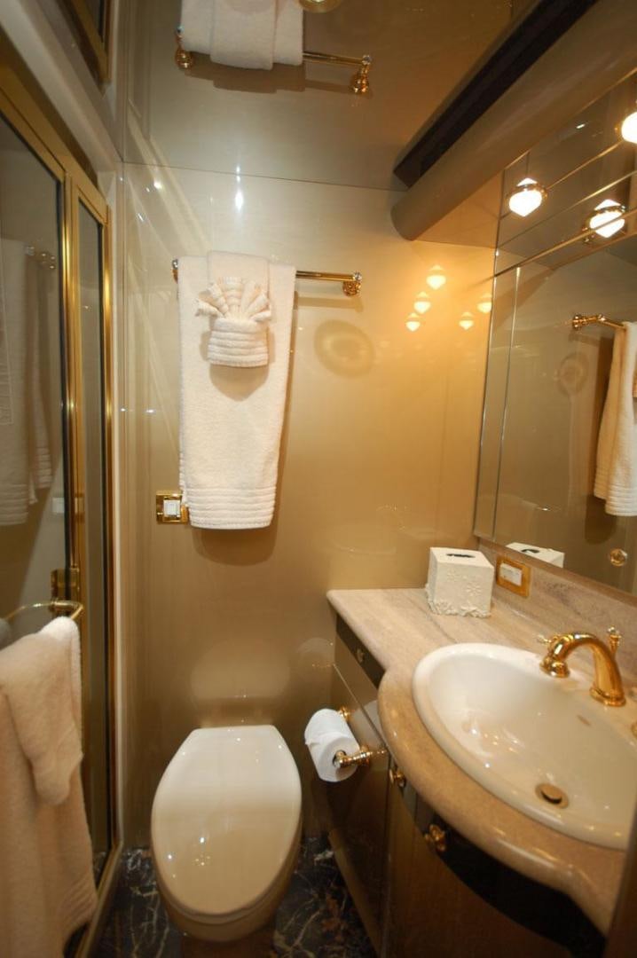 a bathroom with a toilet and sink aboard SELF MADE Yacht for Sale