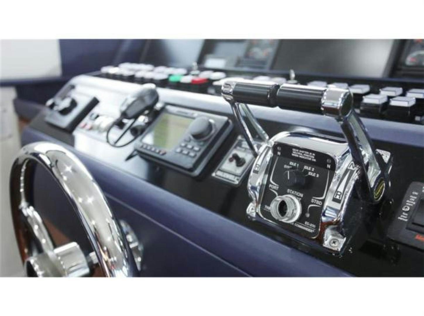 a car with a steering wheel aboard SELF MADE Yacht for Sale