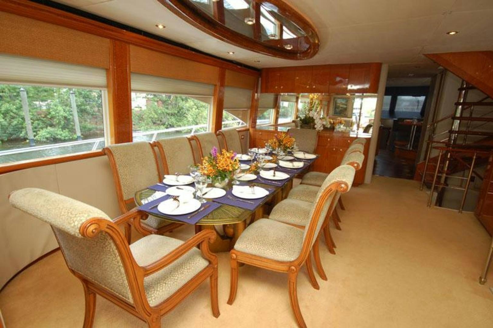 a dining room with chairs and tables aboard SELF MADE Yacht for Sale