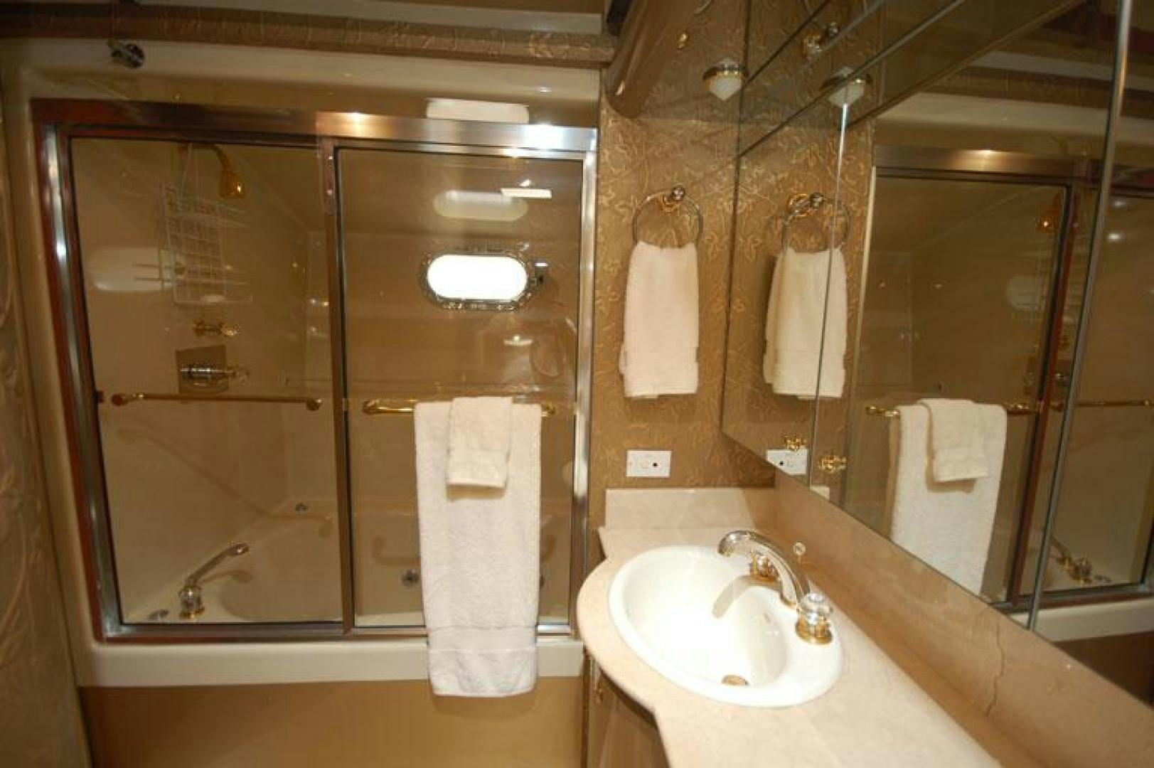 a bathroom with a sink and a mirror aboard SELF MADE Yacht for Sale