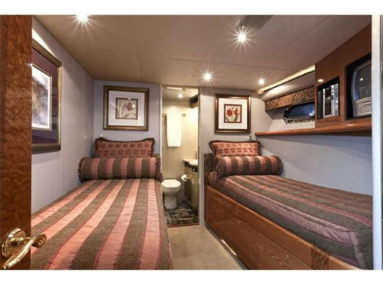 a room with a bed and a couch aboard SELF MADE Yacht for Sale