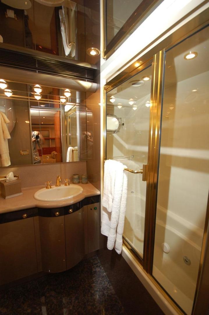 a bathroom with a glass shower door aboard SELF MADE Yacht for Sale