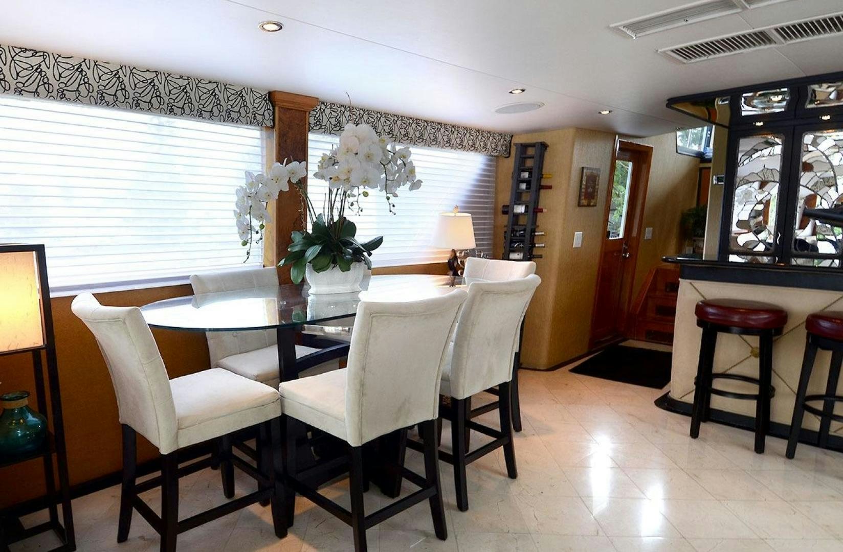 a dining room with a table and chairs aboard GOLDEN GIRL Yacht for Sale