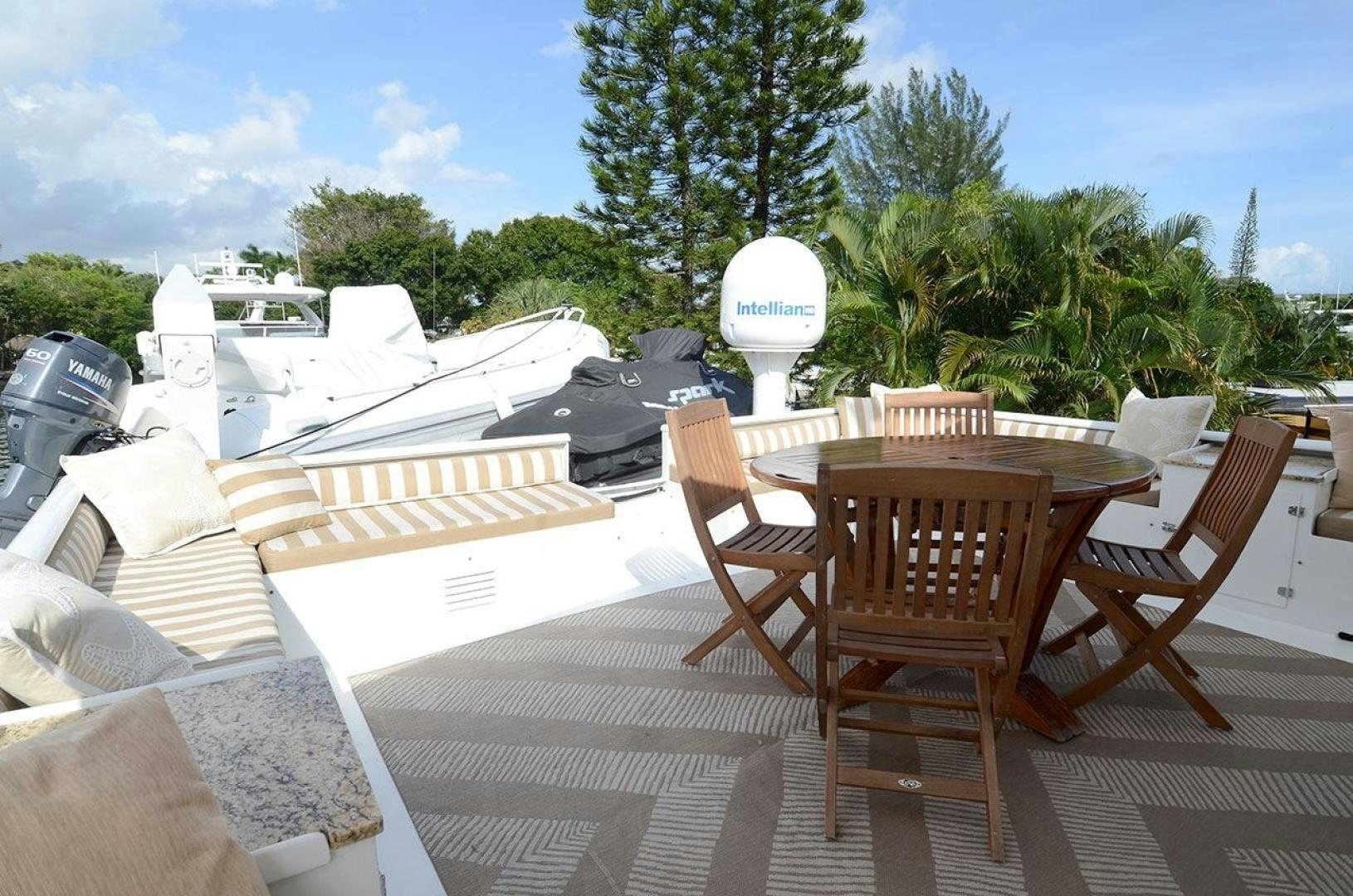 a deck with chairs and tables aboard GOLDEN GIRL Yacht for Sale