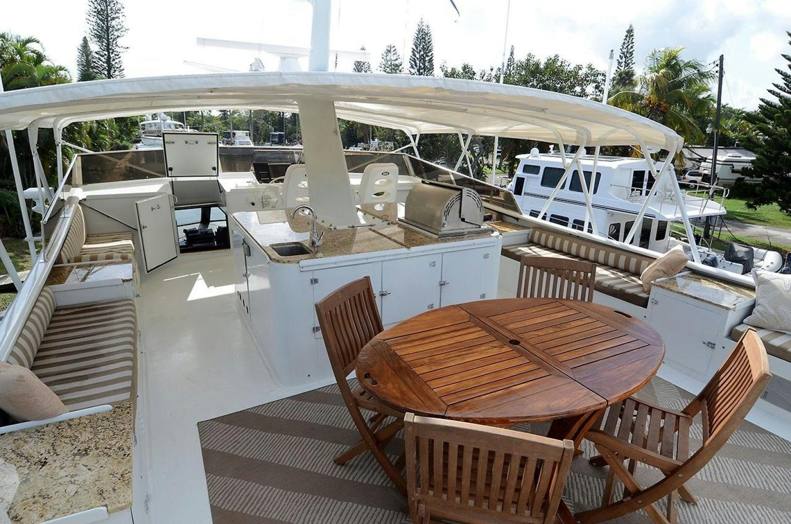 a table and chairs on a deck aboard GOLDEN GIRL Yacht for Sale