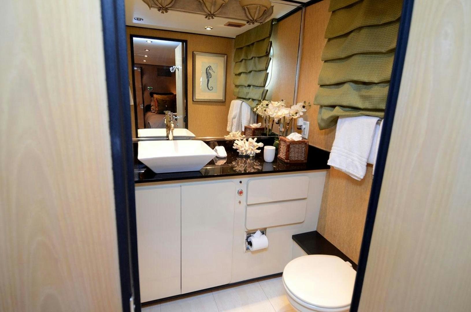 a bathroom with a sink and toilet aboard GOLDEN GIRL Yacht for Sale