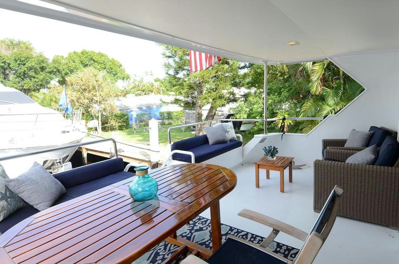 a table and chairs in a room aboard GOLDEN GIRL Yacht for Sale