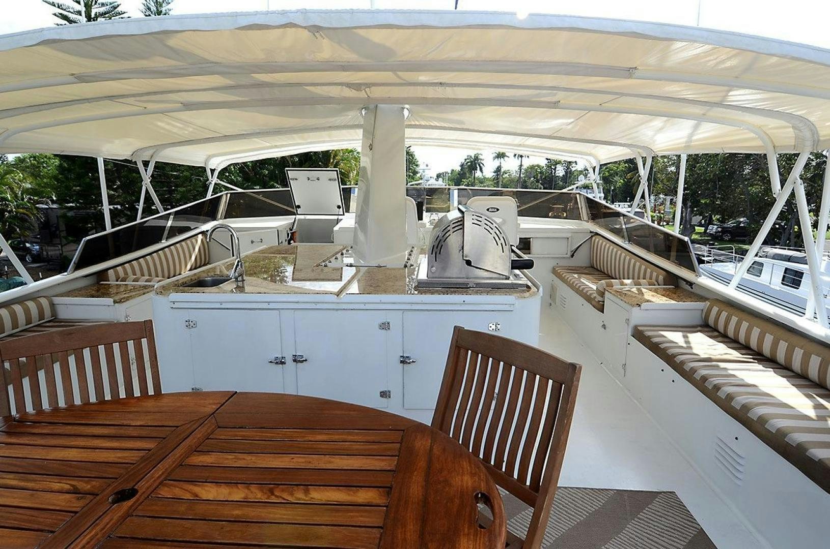 a deck with a laptop and a chair aboard GOLDEN GIRL Yacht for Sale